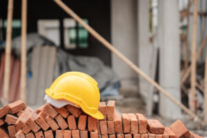 The importance of safety gear for construction workers and the presence of a helmet at a construction site